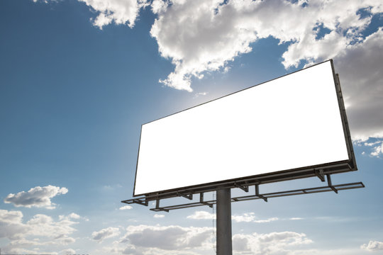 Billboard - Empty billboard in front of beautiful cloudy sky in a rural location