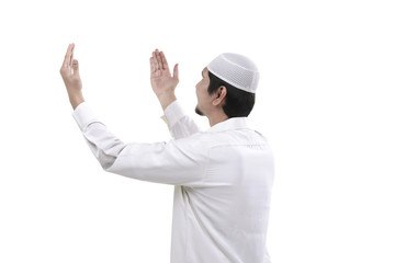 Young muslim man praying
