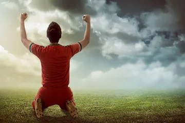 Fototapete Rund Fußball Winning football player  © Leo Lintang