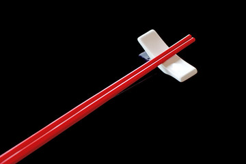 red chopsticks and chopsticks rest