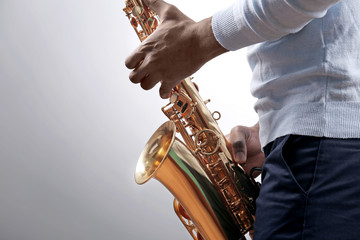 Obraz premium African American jazz musician playing the saxophone, closeup