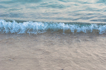 Wave of the sea on the sand beach