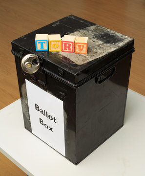 UK ballot box and childs' ABC blocks stating "Tory" in reference to British politics.