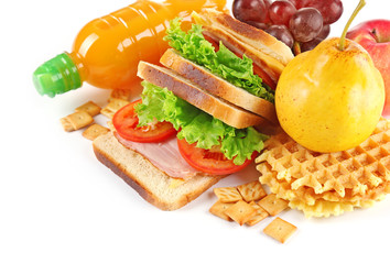 Healthy school lunch with sandwich, fruits and juice isolated on white