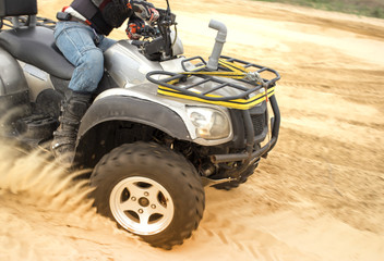 Fototapeta na wymiar Racing ATV is sand.