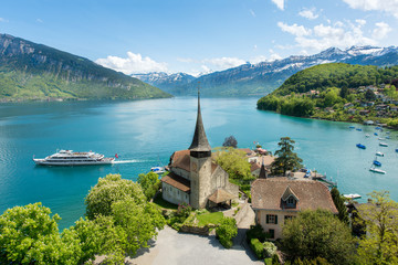 Spiez castle with cruise ship on lake Thun in Bern, Switzerland - obrazy, fototapety, plakaty