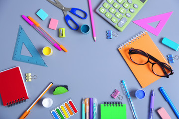 Set of stationery on grey table, top view