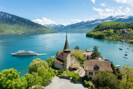 Fototapeta Spiez castle with cruise ship on lake Thun in Bern, Switzerland