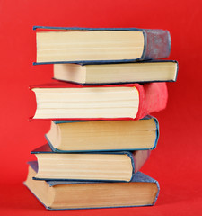 Stack of  books on red background