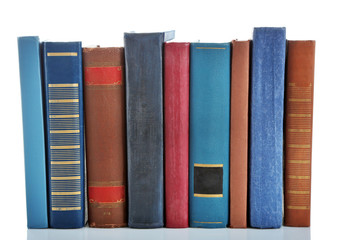 Books positioned in a line isolated on white