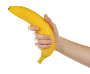 Female hand holding banana isolated on white © Africa Studio