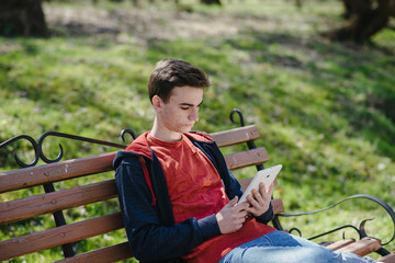 Fototapeta premium The guy with gadgets