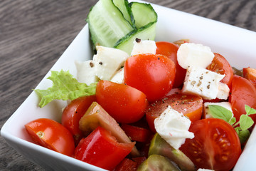 Salad with mozzarella, tomato and cucumber