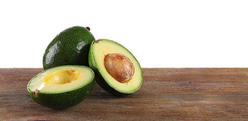 Fresh avocado on wooden table