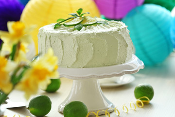 Big lime cake on a white stand