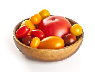 Variety of tomatoes isolated, multicolored tomatoes isolated on white background.