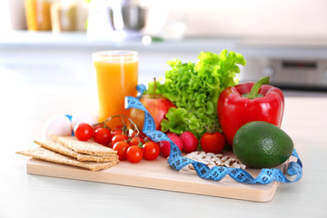 Set of fresh fruits and vegetables on wooden table closeup