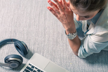 Woman with a laptop at her home