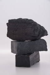 carbon soap  and a pile of coal on white background