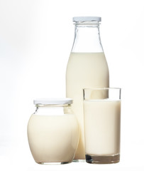 Bottle, bank and glass of fresh rural milk