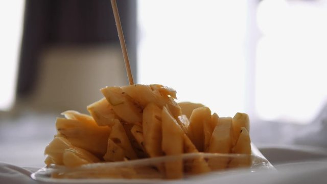 closeup of eating Pineaple