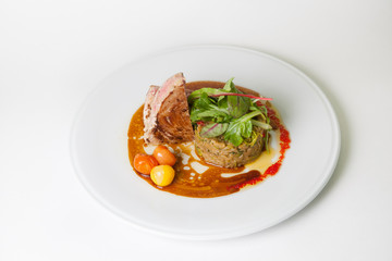Beef steak with rice garnish