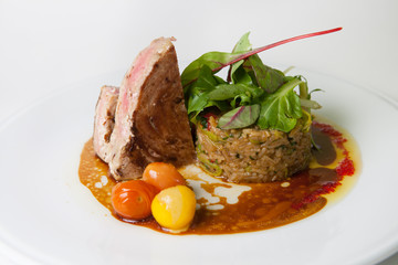 Beef steak with rice garnish