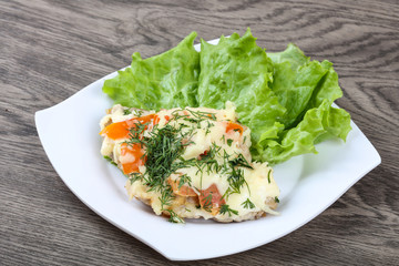 Meat covered cheese and tomato