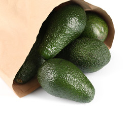 Fresh avocados in paper bag isolated on white