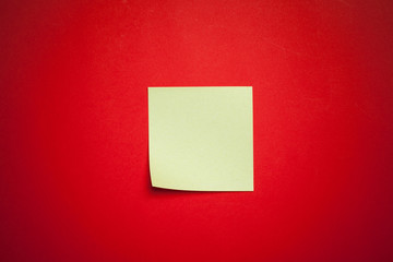 Reminder sticky notes on red background