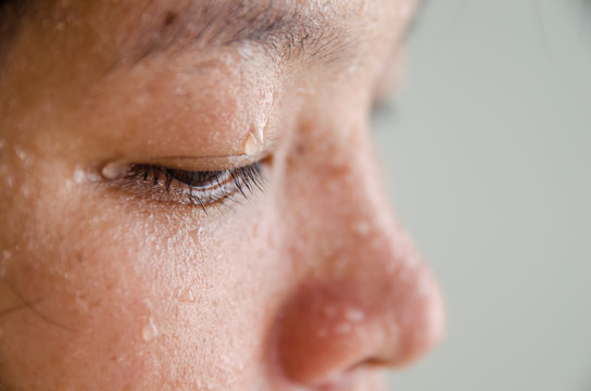 Close up sweat on eyes with young asian woman