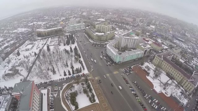 Aerial shot of central part of the city Kursk, Russia. Red Square and car traffic on snowy winter day