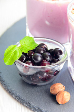 Berries of black currant in glass bowl