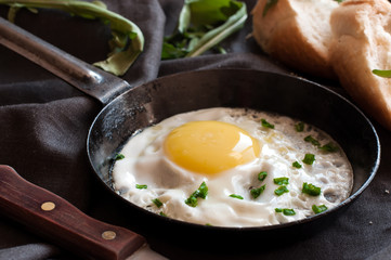 Fried egg in frying pan with bow