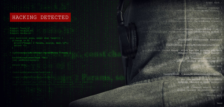 hooded anonymous computer hacker hacking detected