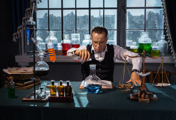 Scientist chemicals mixed in a round bottom flask and the solution was blue