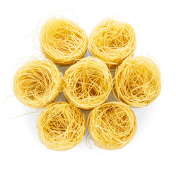 Pasta nests laid in the form of flower isolated