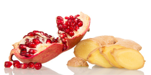 The broken pieces  pomegranate and ginger isolated on  white background.