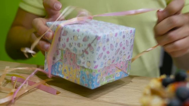 Male hands open gift box