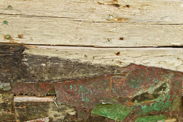 rusty metal on wooden plank.