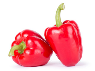 Two ripe peppers on a white background