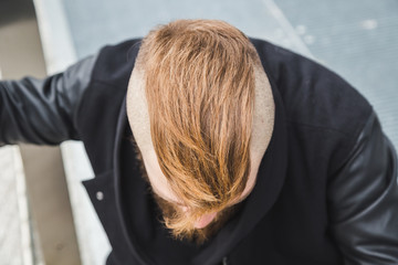 Stylish bearded man posing in the street