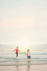 Fototapeta premium Children playing outdoors at the beach.