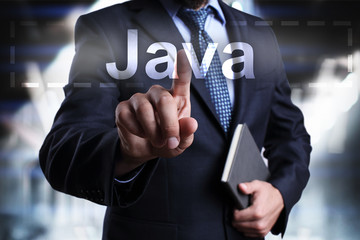 Businessman is pressing on the virtual screen and selecting Java.