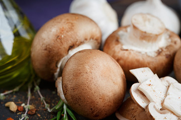 Button mushroom with rosemary, onion and peppercorns. Still life