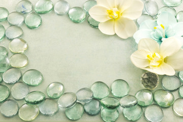 Blue glass drops aqua with white flowers orchid background