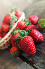 fresh strawberries on a wooden background