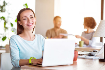 Nice smiling  woman using laptop   
