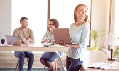 Nice smiling woman using laptop   