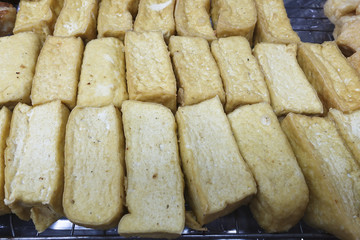 Fried tofu waiting for sale.